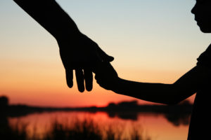 Low Conflict Custody Lawyer Ogden, UT - silhouette parent and child hands